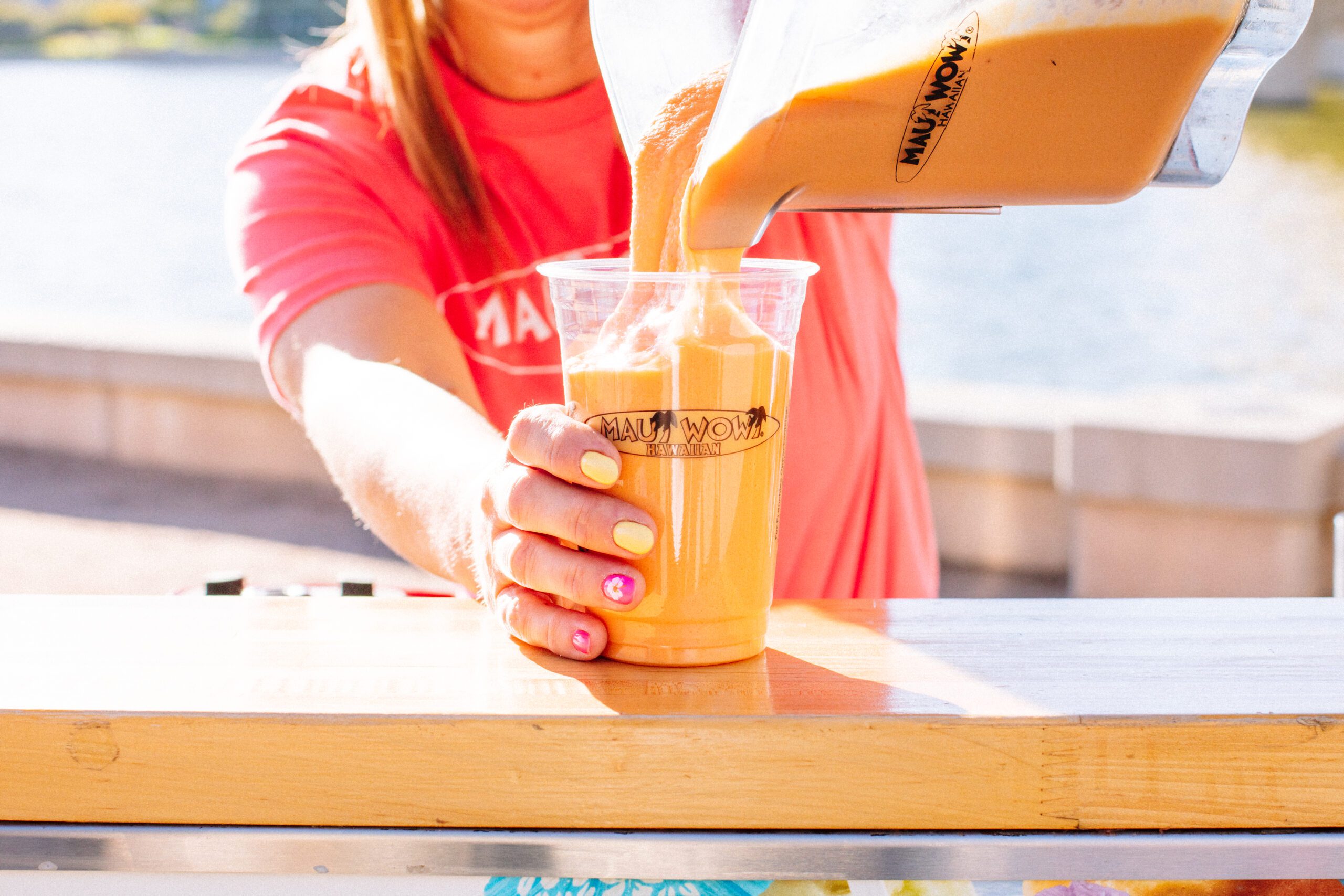 woman pouring smoothie franchise training and support