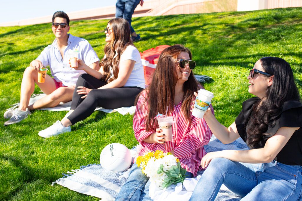 drinking smoothies in a park