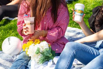 Maui Wowi customers holding cups
